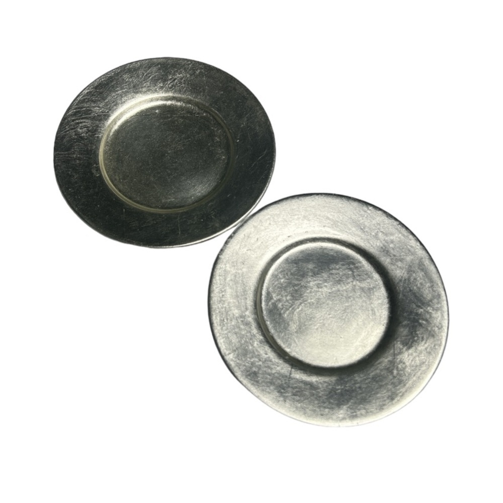 Two Ceramic Plates Covered In Silver Paint